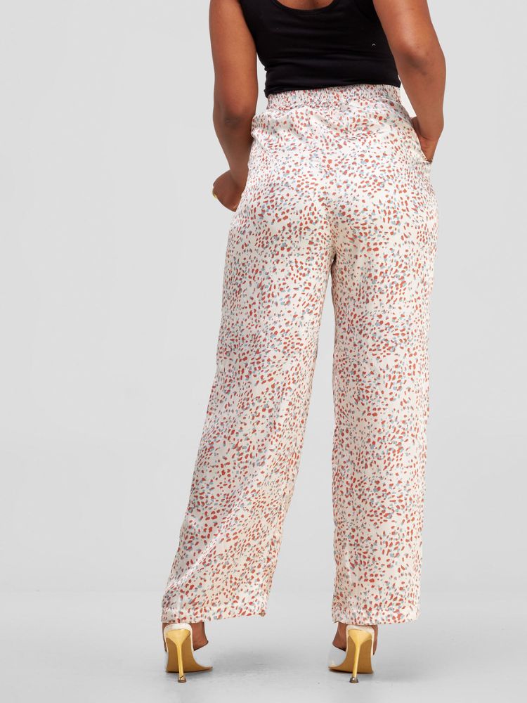 flowing palazzo pants with a discreet side zipper and a comfortably stretchy waistband at the rear.