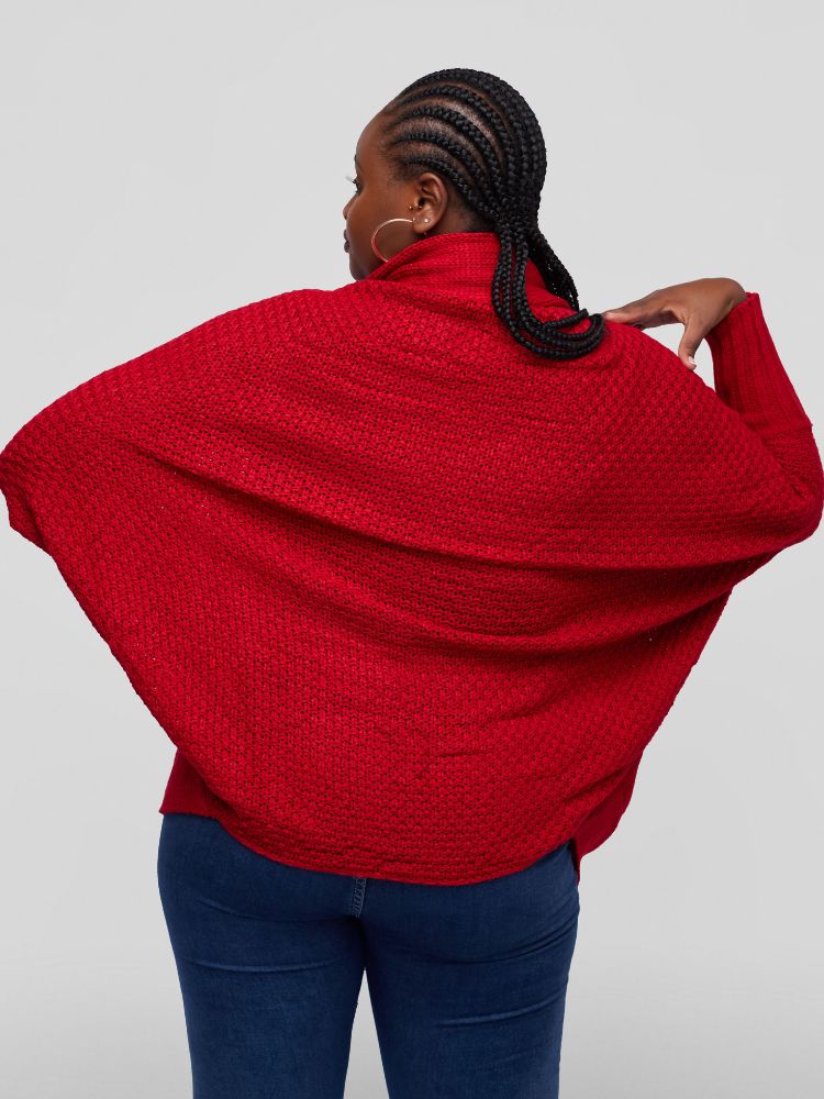 A hip length cardigan with a batwing long sleeve design.