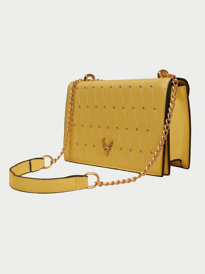 Small leather sling bag with gold chain straps and a beaded design at the front.