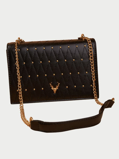 Small leather sling bag with gold chain straps and a beaded design at the front.