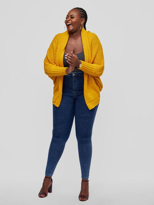 A hip length cardigan with a batwing long sleeve design.
