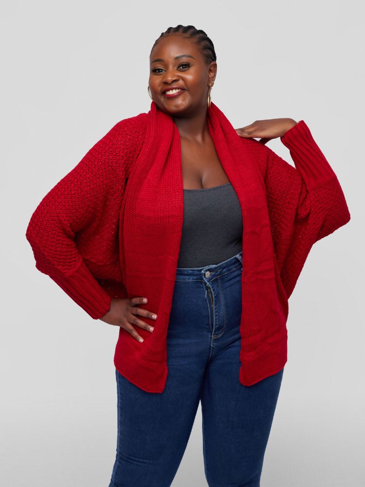 A hip length cardigan with a batwing long sleeve design.