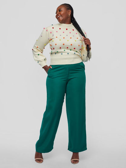 Sweater with a chic mock neckline, long sleeves, and a flattering waist-length fit with colourful knitted balls.