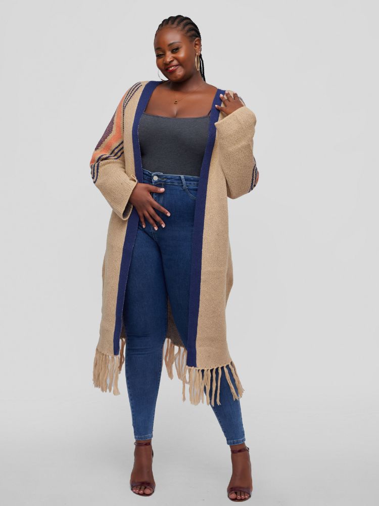 Open cardigan with long sleeves, a midi length, and playful tassel accents at the hem.